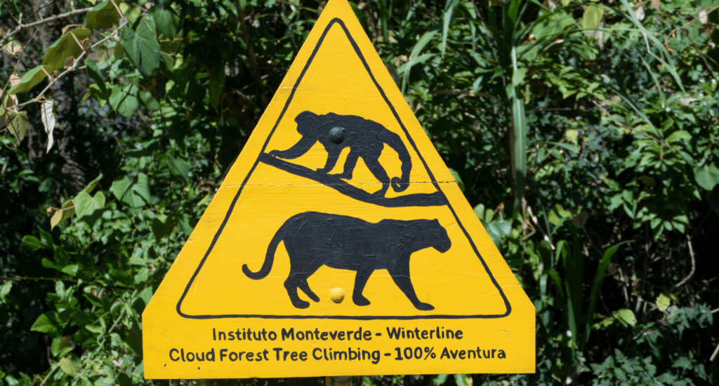 Costa Rica - Children's Eternal Rain Forest in Costa Rica - warning sign for monkeys and Pumas