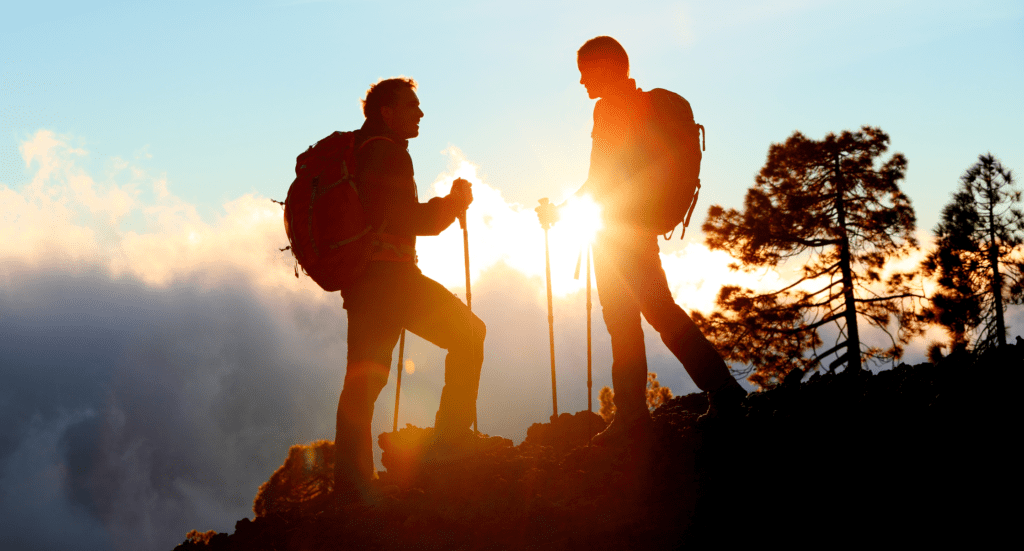 Hiking Couple Looking Enjoying Sunset View on Hike
